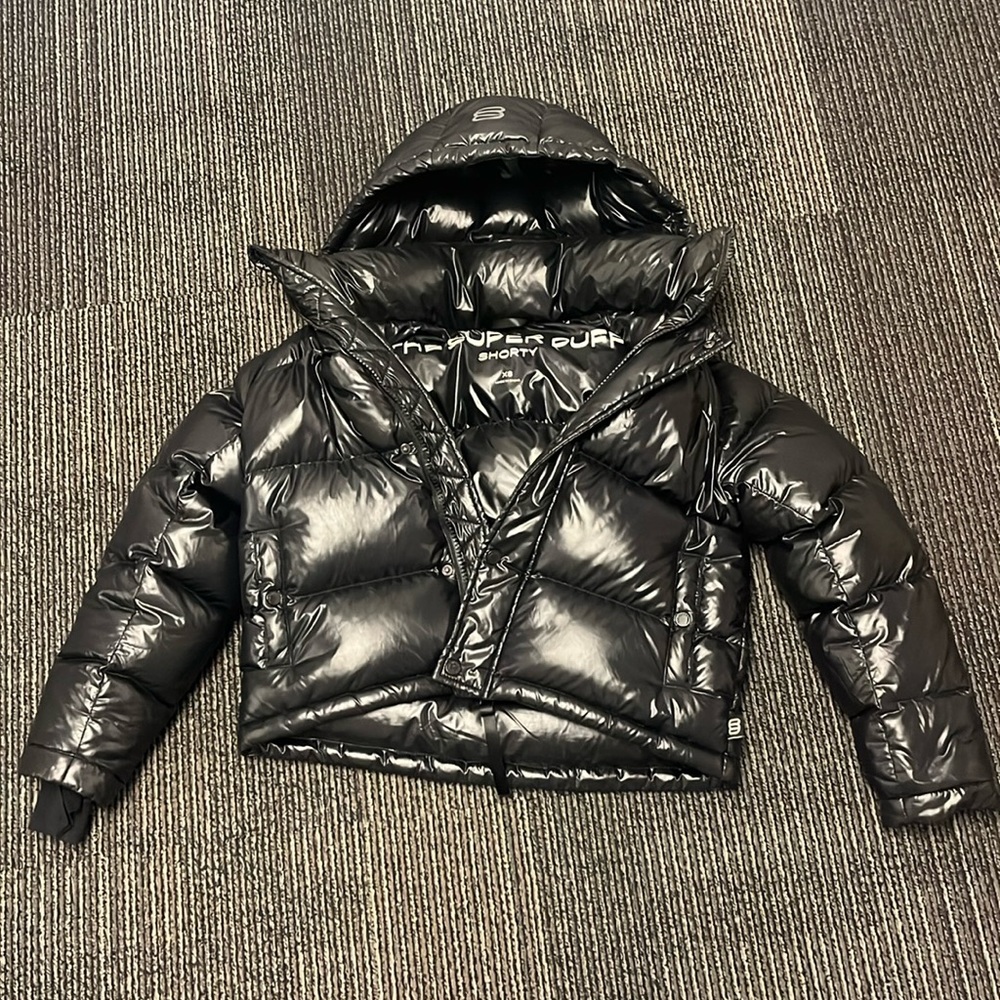The Super Puff winter jacket from Aritzia. Shiny Black.